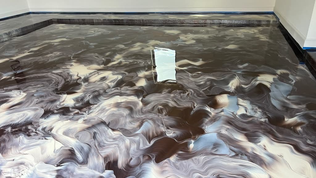 Brown, cream, and charcoal metallic floor across a finished interior