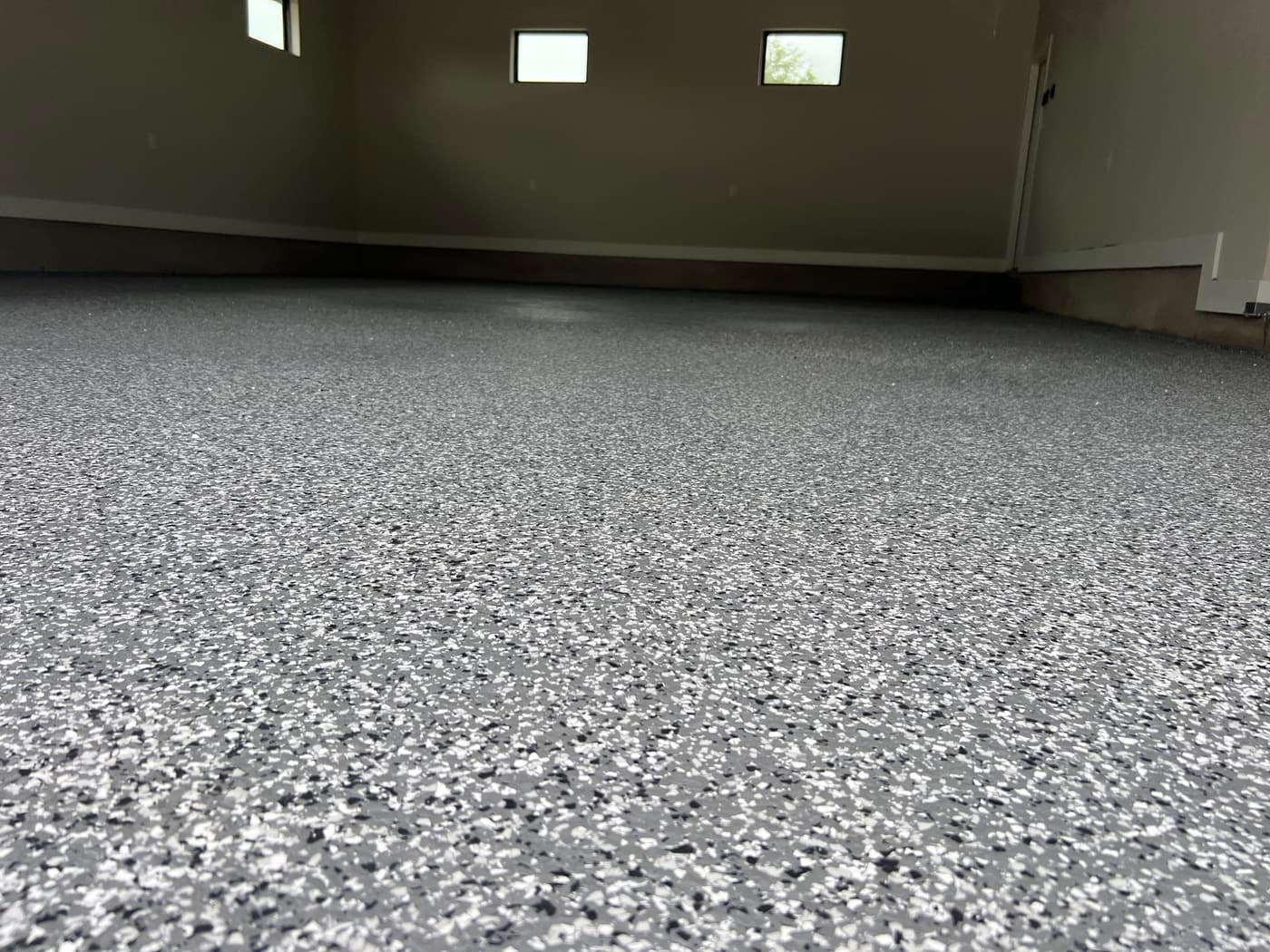 Close view of a completed gray decorative flake floor