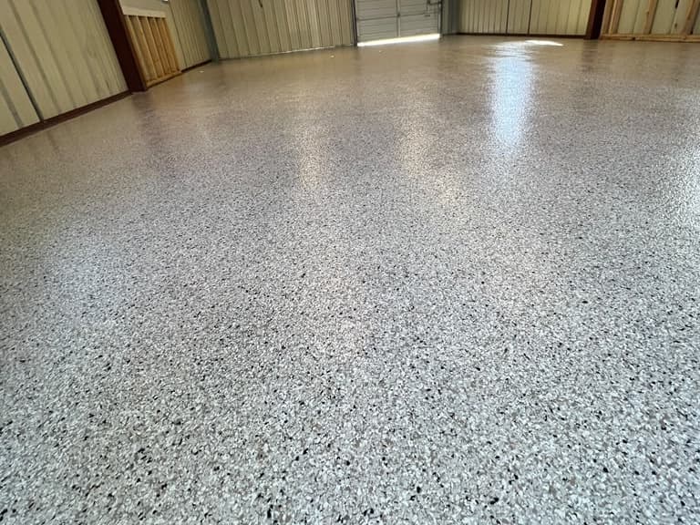 Completed light flake floor across an industrial interior