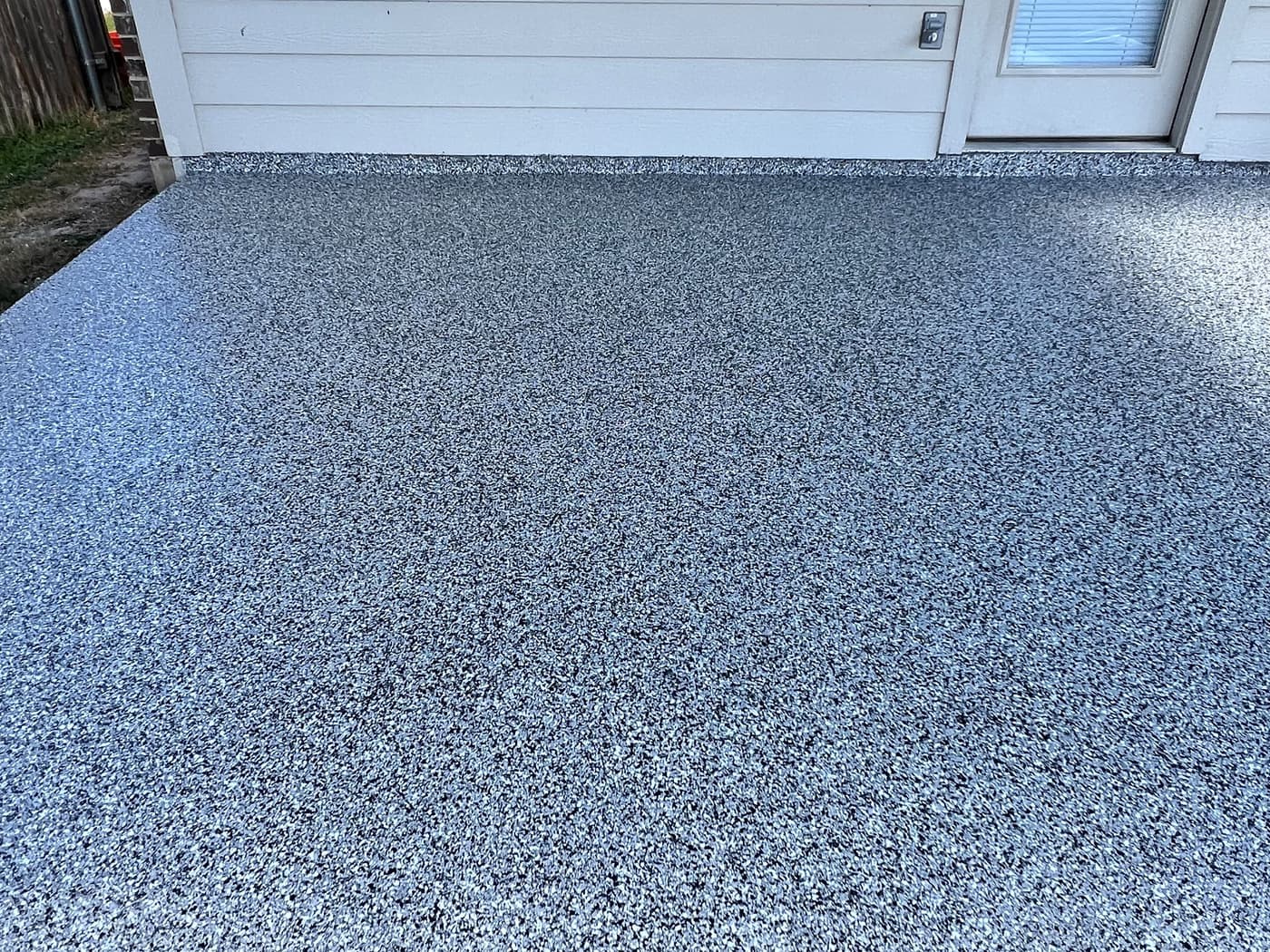 Completed gray textured coating across a side-entry walkway