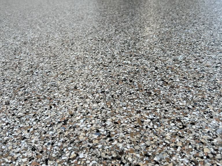Close view of a neutral decorative flake floor texture