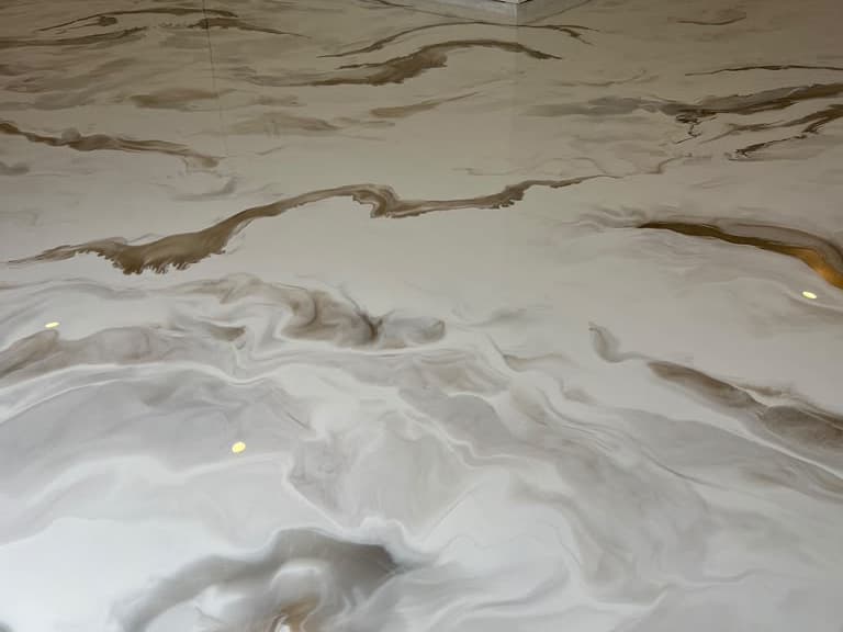 Completed light neutral Metallic epoxy floor in a residential interior