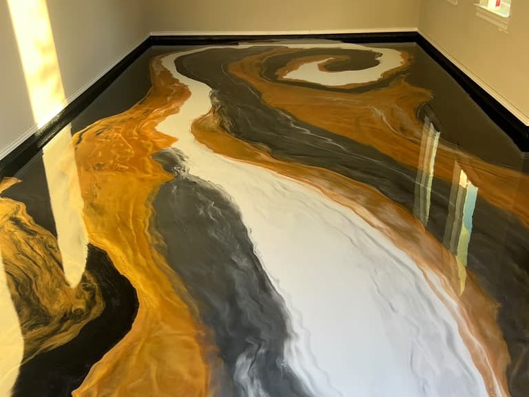 Gold, white, and charcoal metallic epoxy floor