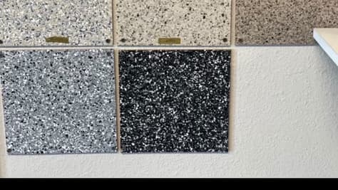 Selection of light, gray, and black decorative flake finish samples